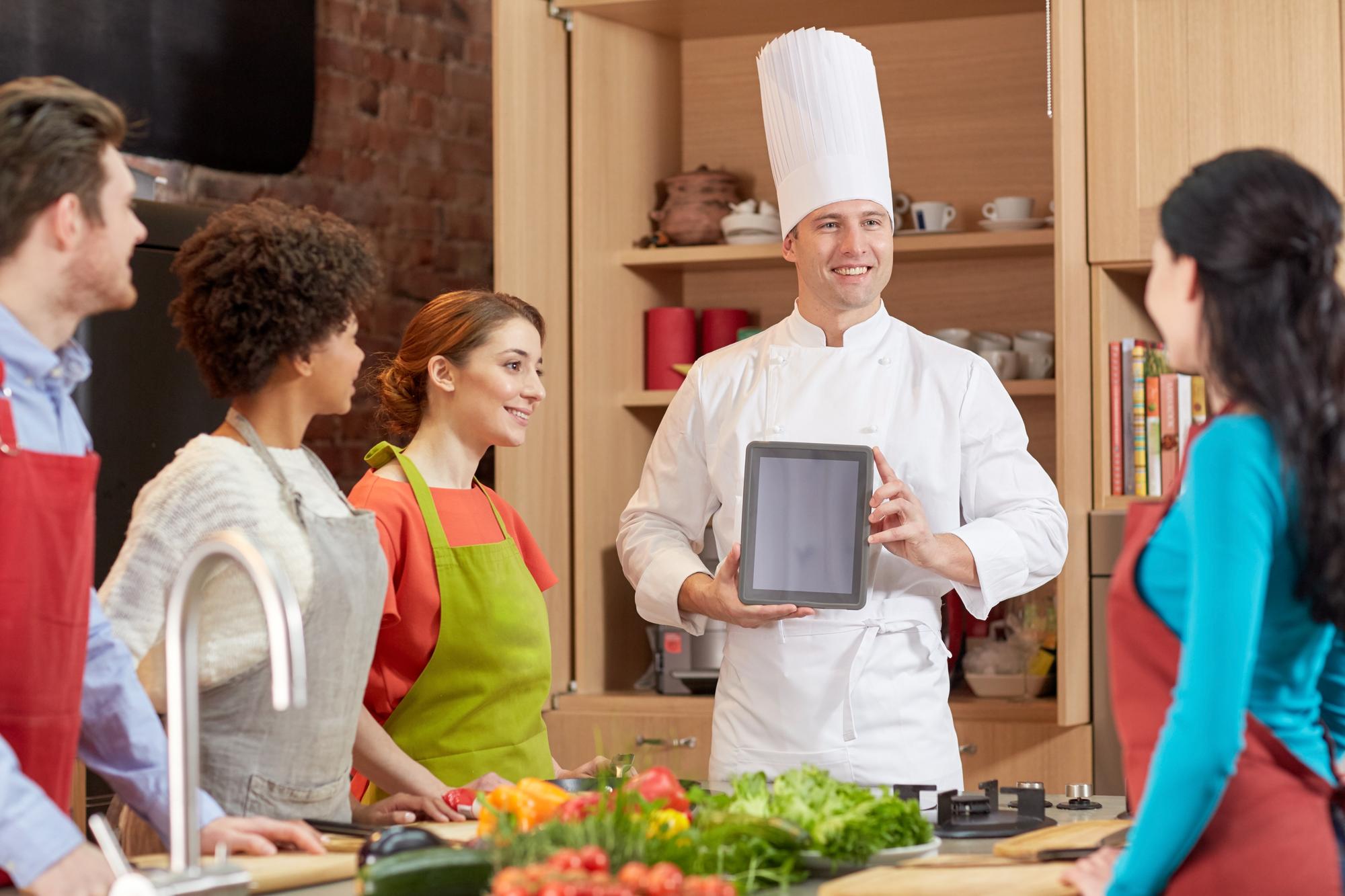 Chef explaining a technique to participants
